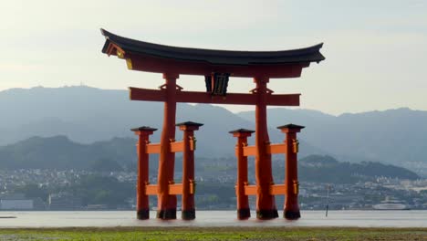 timelapse of sunset red giant torii at itsukushima shrine temple at miyajima hiroshima japan no people tourist