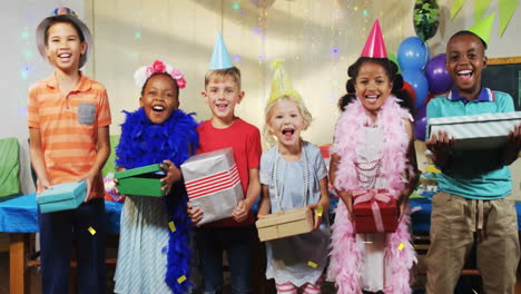 children holding gifts and wearing party hats, confetti animation over background