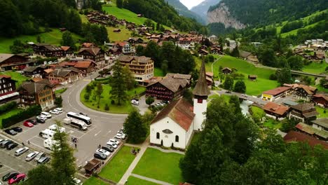 cloudy day over lauterbrunnen, swiss village nestled among lush green mountains