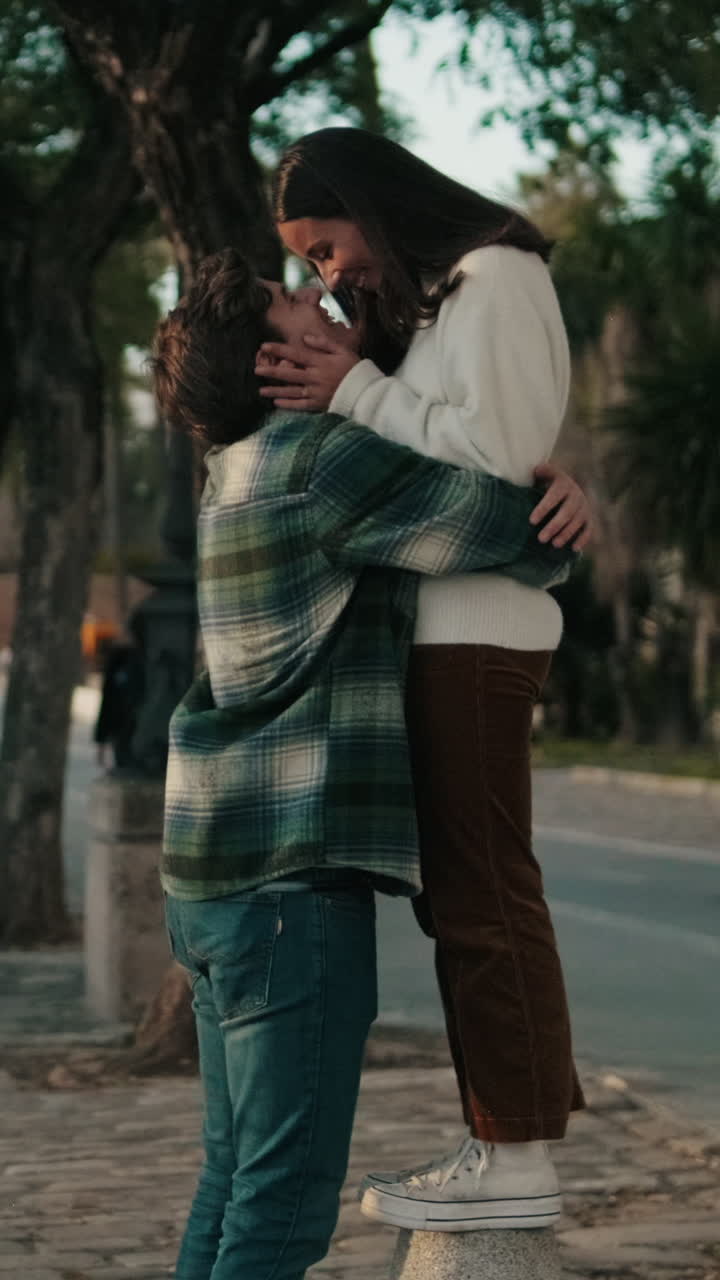 Couple Shares a Kiss in Seville Park
