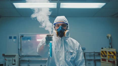 scientist in protective gear holding a smoking test tube in a laboratory
