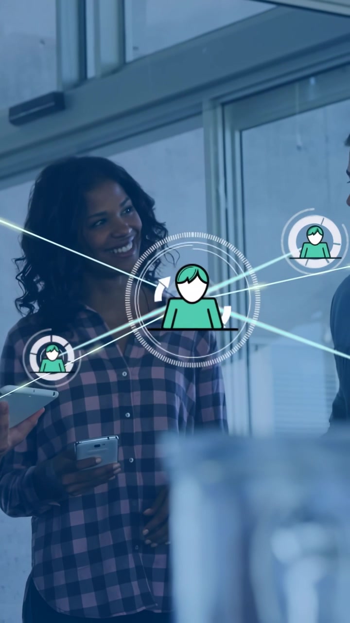 Vertical video: Woman tapping phone and tablet sparking network overlay for tech teams