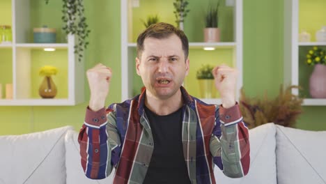 the determined male speaker is ambitiously telling something to the camera and those around him.