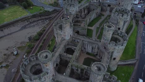 medieval conwy castle walled market town flying above stronghold aerial view