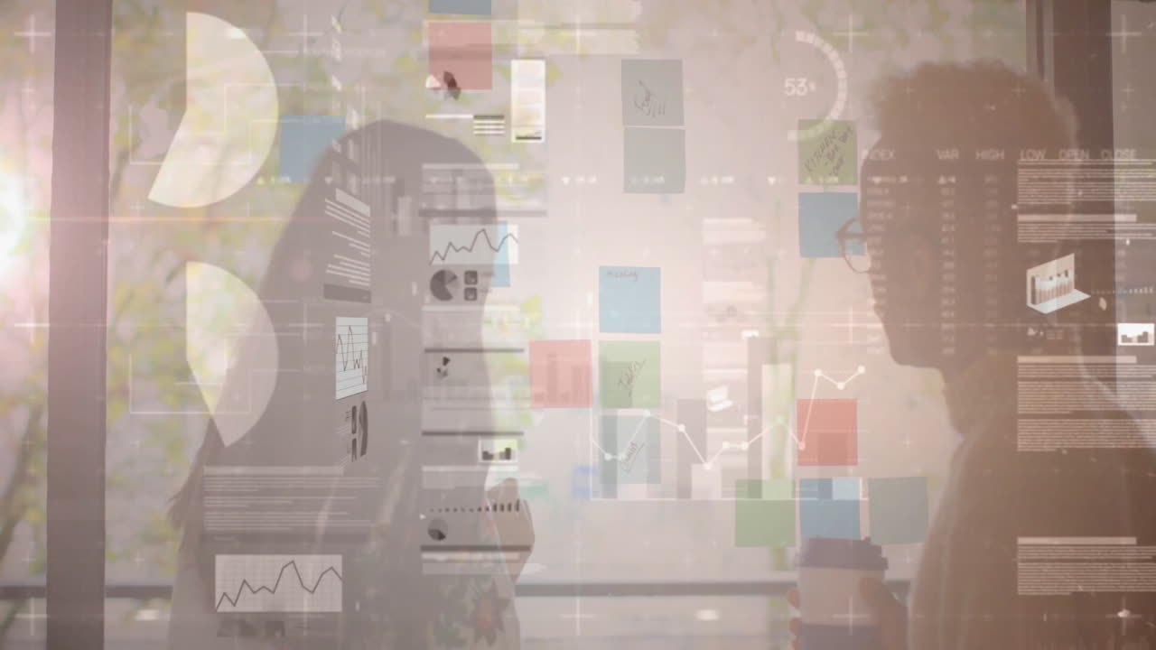 Two professionals collaborating at glass partition, using sticky notes with neon tech data charts