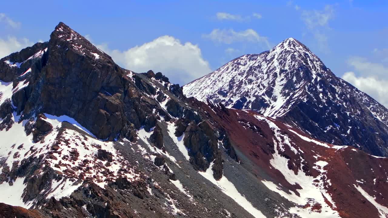 Mt Mount Lindsey 14er North Ridge trail Blanca Peak Sangre De Cristo Range aerial drone Colorado spring summer snow fields melting morning blue sky clouds Rocky Mountains summit parallax right zoom in