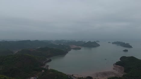 Aerial-View-of-village-on-Cat-Ba-Island,-Vietnam-near-Ha-Long-Bay-and-Lan-Ha-Bay