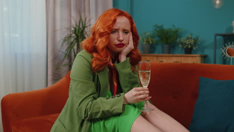 sad depressed young redhead girl suffers from unrequited love, drinking champagne, problem, bad news