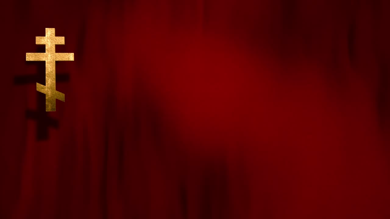 cruz cristiana ortodoxa rusa en bucle en un marco completo con fondo de seda de terciopelo rojo