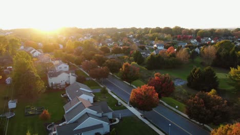 aerial panoramic view of neat community of homes in northeastern usa during autumn sunset