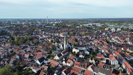 aerial drone shot of handschuhsheim, flying above town orbiting around friedenskirche church