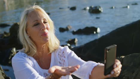 disabled woman clicking photo with mobile phone 4k