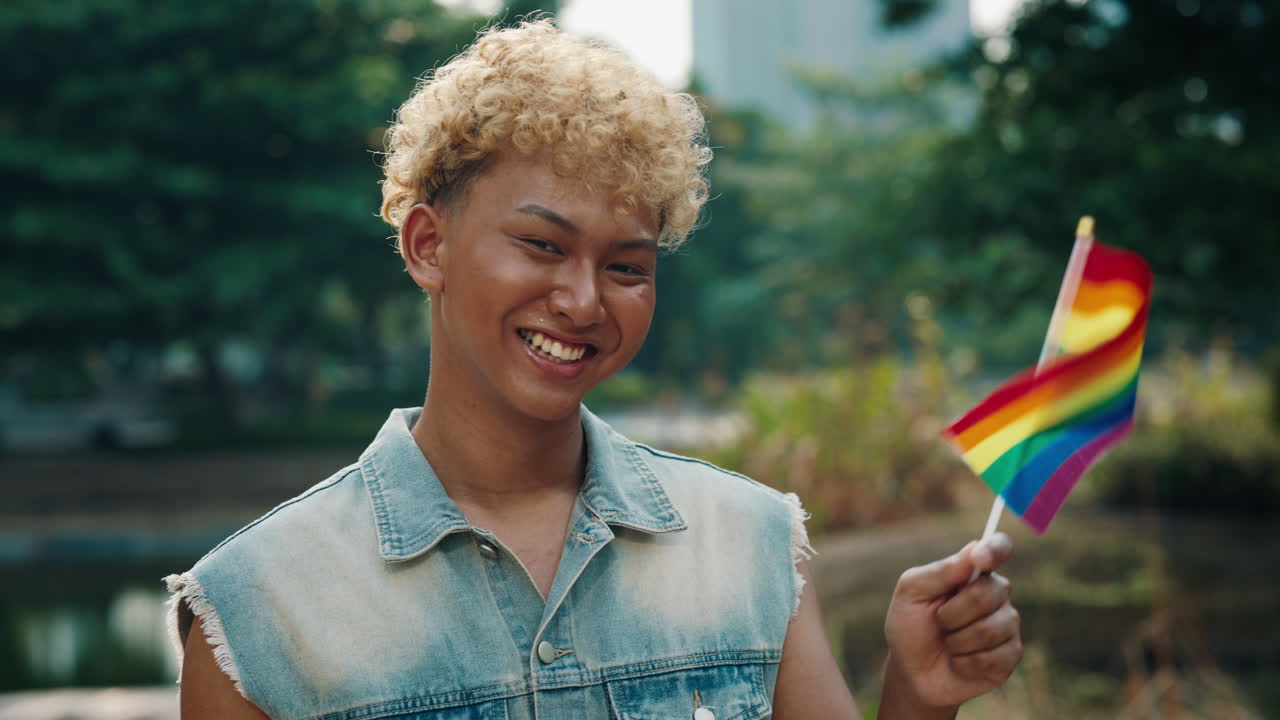 Smiling Young Adult with LGBTQ Pride