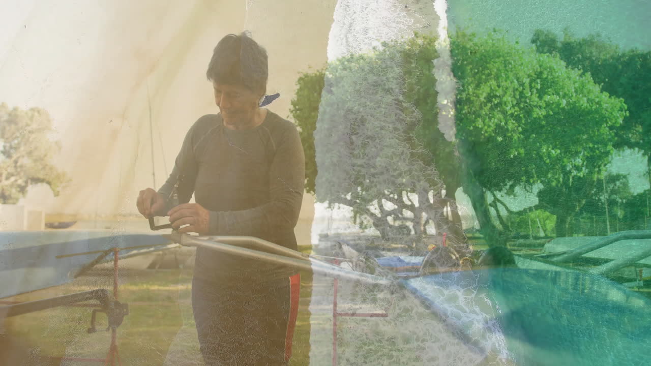 Senior woman adjusting fishing rod reel near lake, showcasing outdoor recreation data overlays