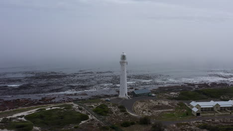 lighthouse in the fog mystic atmosphere aerial shot south africa