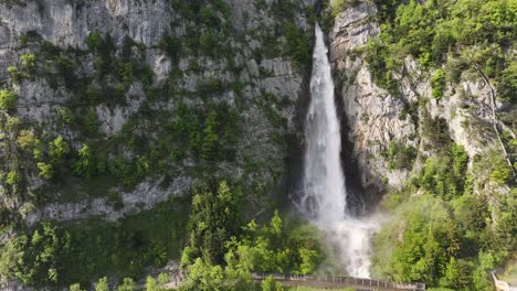 The-majestic-sight-of-cascading-water-against-a-backdrop-of-rugged-terrain-at-Seerenbachfälle-in-Amden-Betlis,-Walensee,-Switzerland,-highlights-the-raw-beauty-and-power-of-nature