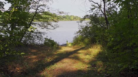 hiking towards a northern ontario lake at sunset