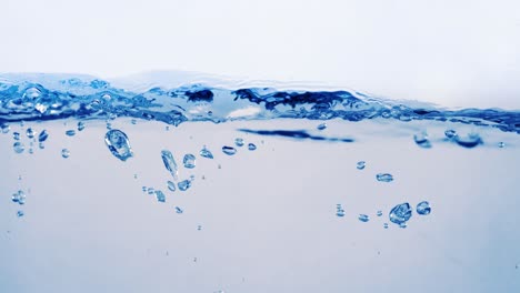 many bubbles in water close up, abstract water wave with bubbles in slow motion