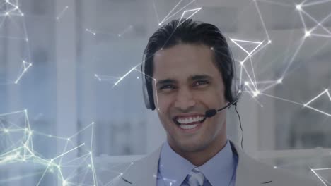 Animation-of-network-of-connections-over-businessman-with-headset-in-office