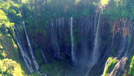 tumpak sewu rainbow waterfalls aerial scenic view, indonesia