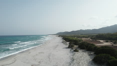 Aerial-fly-over-view-drone-over-beach-sea-and-rock-coast-with-powerful-sea-waves