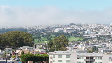 from above, broadmoor presents a clean-cut suburban layout bordered by daly city’s surrounding topography. ascending aerial view captured in 4k