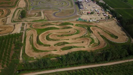 aerial circling drone view of ottobiano kart raceway in italy