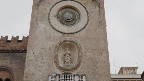 close up of torre dell'orologio on palazzo della ragione in mantua, mantova italy.