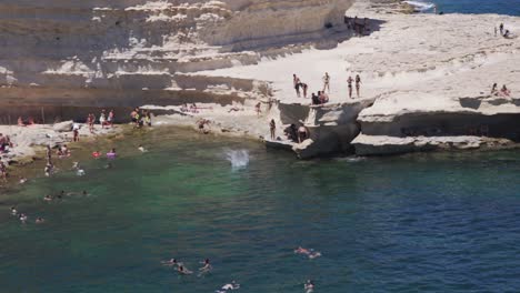 crowd enjoying a sunny day at rocky bay of st