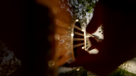 playing guitar outdoors