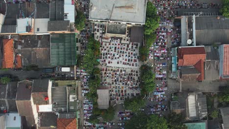 aerial view of people offering prayers on the eid morning at famous mosque jama masjid in bekasi