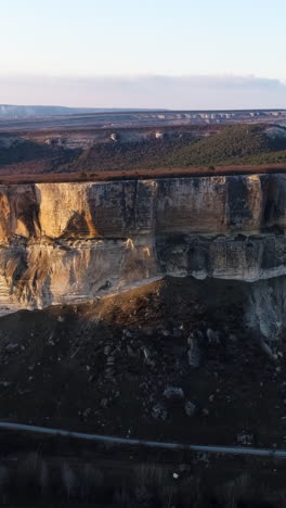 dramatic cliffside landscape at sunrise/sunset