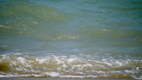 surging waters splashing and pounding in swells of waves at the seaside of pattaya beach in chonburi province in thailand