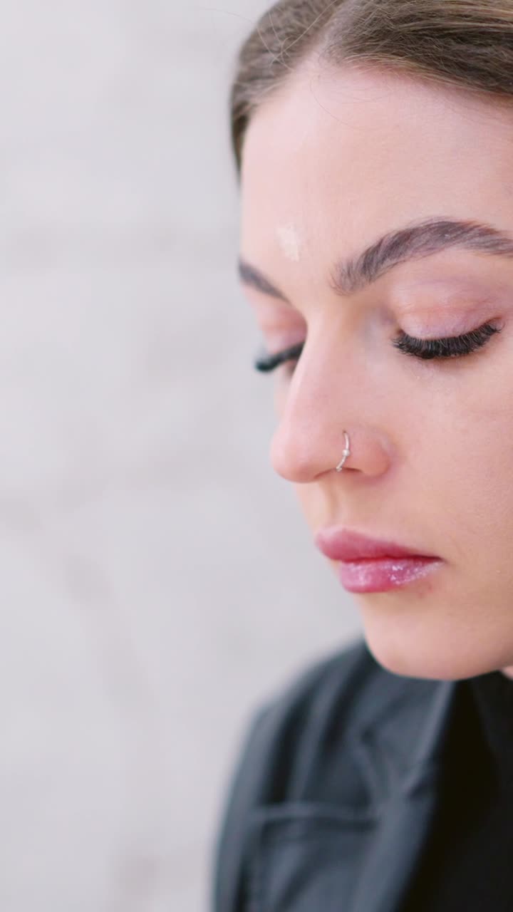 Woman applying makeup with a beauty blender