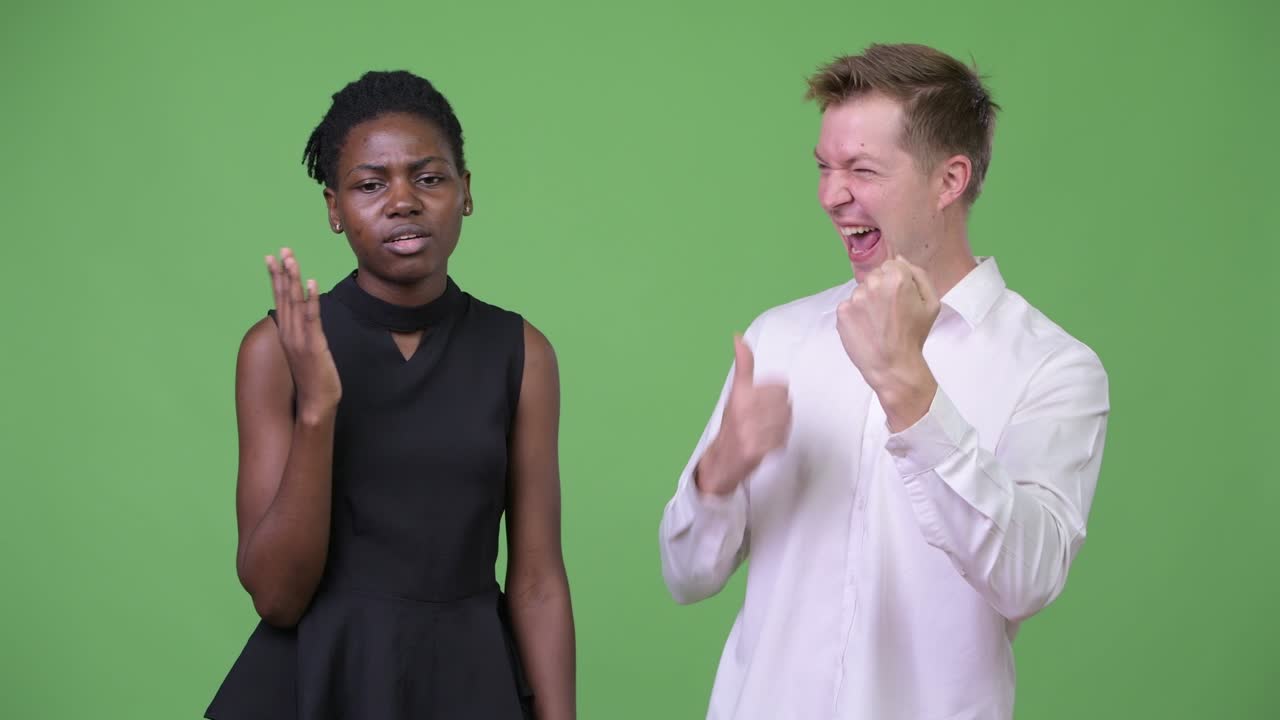 Two young multi-ethnic business couple together