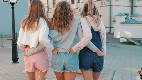 three women friends enjoying a summer day in the city