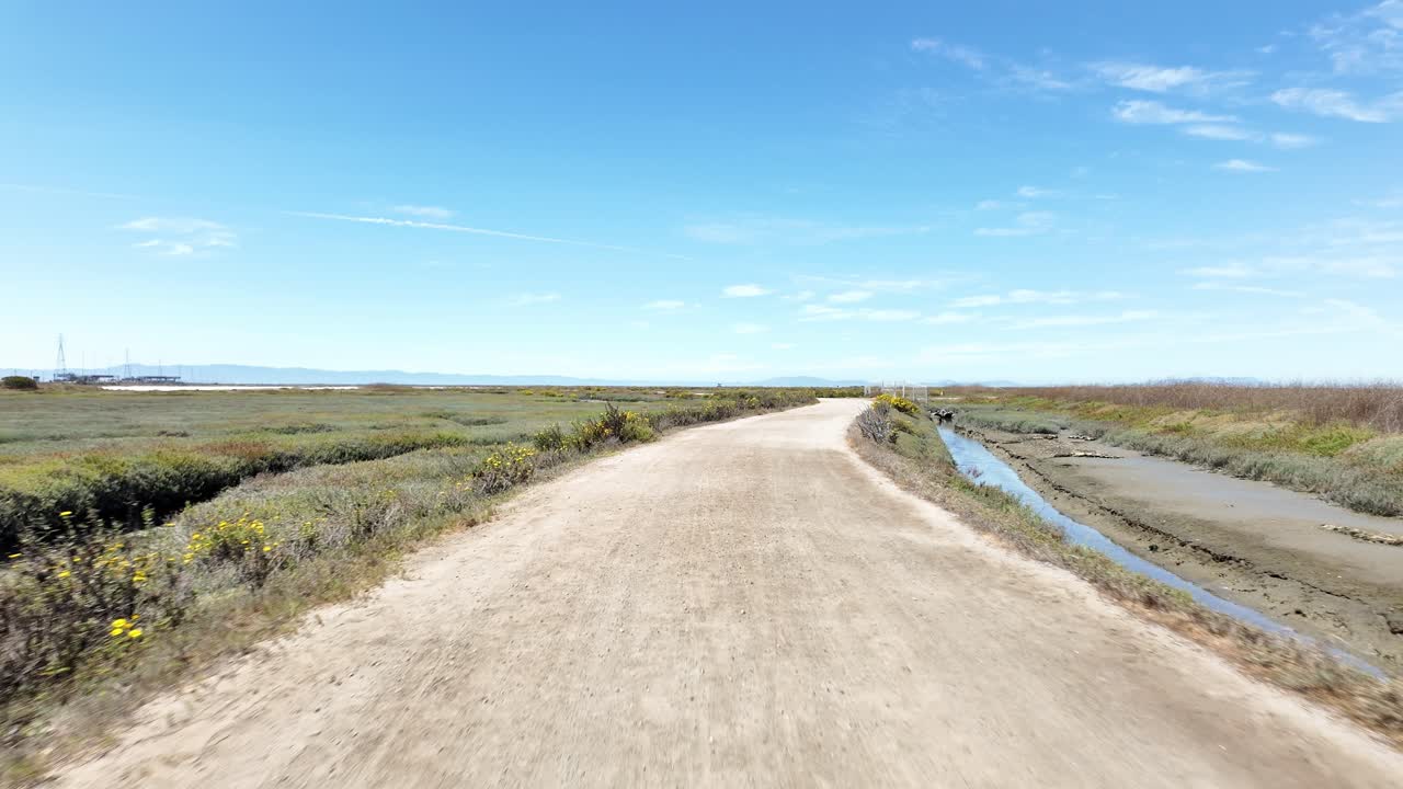 Wide afternoon view of Hayward Nature Recreation Area shows natural grasslands, bay waters, and trails, useful for Bay Area landscape, recreation, and conservation stock footage