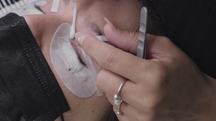Close up of false eyelash placement on the eye