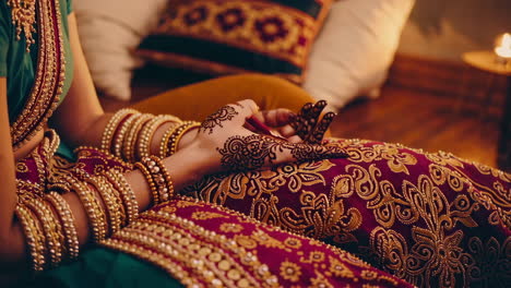 henna design on hands of an indian woman