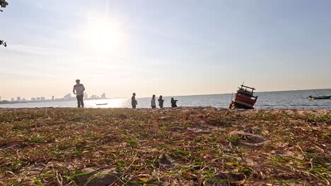 people enjoying a serene beach sunset