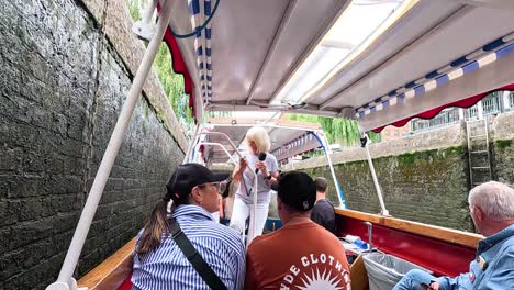 people enjoying a narrow boat ride in london