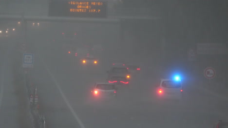 Traffic-on-a-highway-south-of-France-heavy-rainy-day-lights-on-stormy-weather