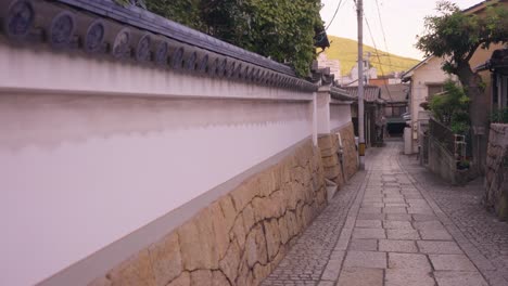 japanese traditional town road through tomonoura, alleyway through stone path