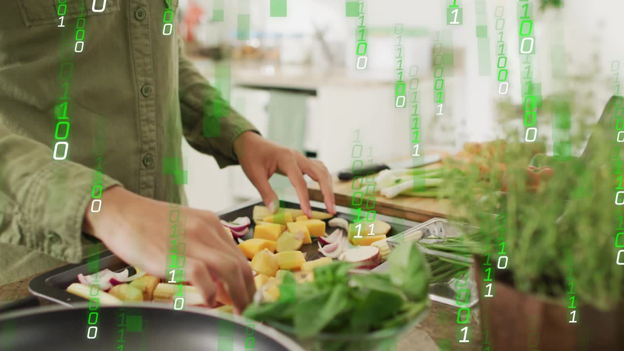 Home cook arranging vegetables for meal prep as green tech code starting cascading across kitchen
