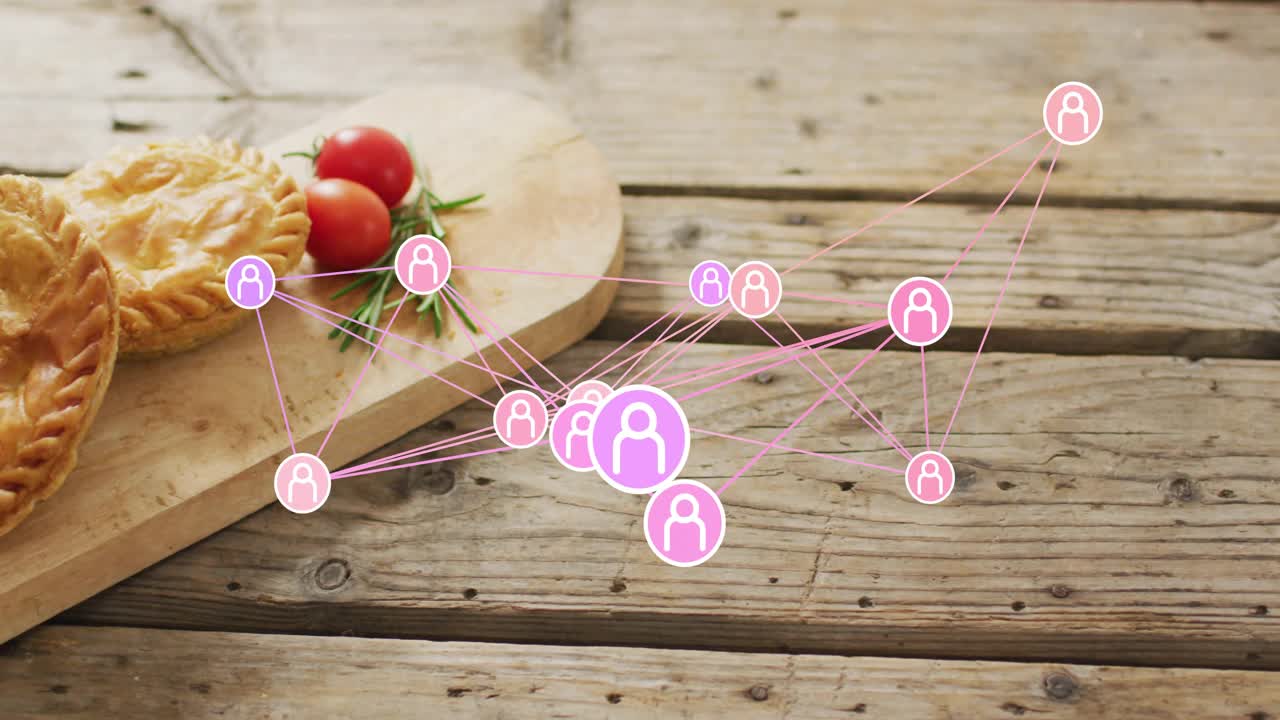 Piccoli nodi che appaiono, icone rosa che si collegano, pulsano e si spostano vicino a un tagliere, mostrando una rete.