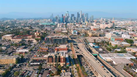 Downtown-Los-Angeles-with-residential-buildings-and-business-skyscrapers,-establishing-cityscape,-sunny-day