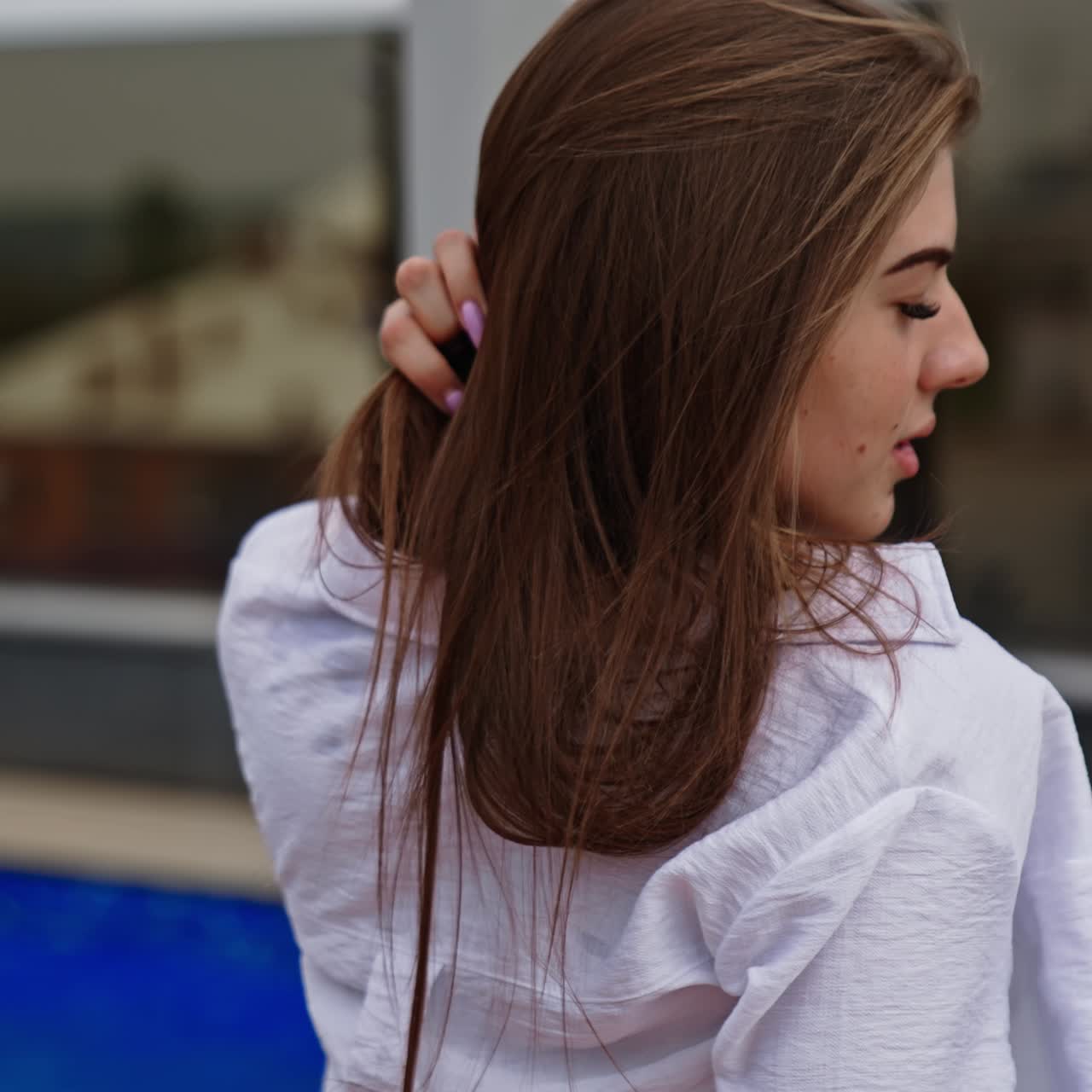 Slim pretty ladies near poolside having fun. Summer beautiful women tanning with drinks