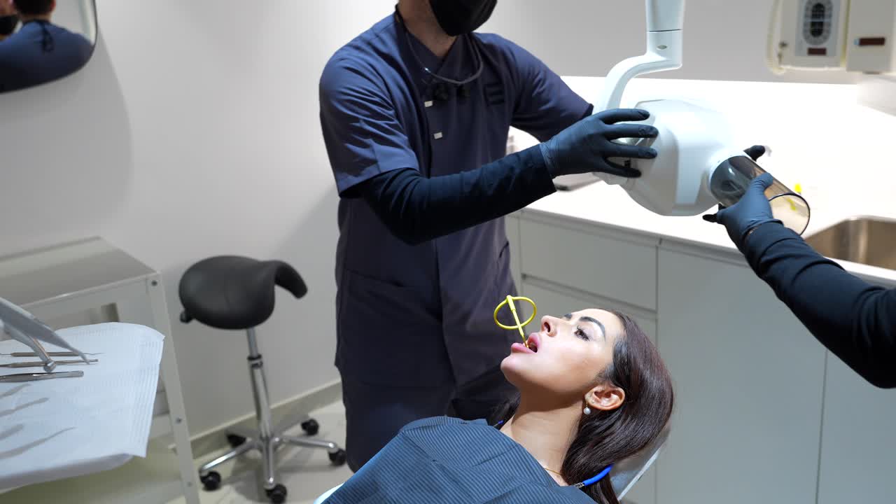 Dental Checkup: Dentist Performing Examination and X-Ray on Patient