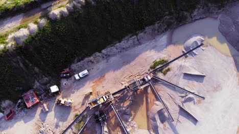 Aerial-straight-down-shot-from-a-drone-of-quarry-and-heavy-machinery-in-pomeranian-district-in-Poland