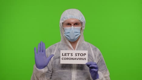 portrait of medical doctor in ppe suit with text inscription slogan on paper lets stop coronavirus